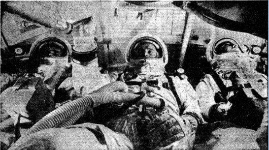 “The astronauts practicing in an Apollo capsule, identical to the one in which they died. From left: Chaffee, White, Grissom.” "Death . . ." Sunday Times, 29 Jan. 1967, p. 11. The Sunday Times Digital Archive