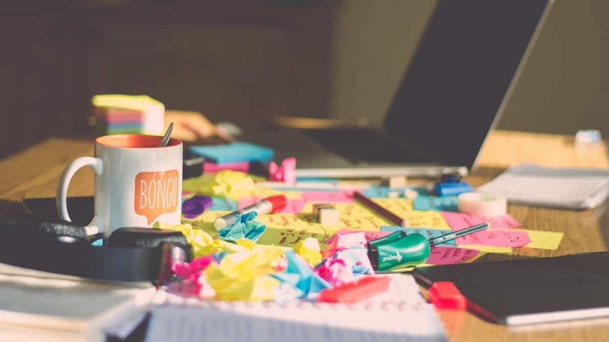 Sticky notes and laptop on table